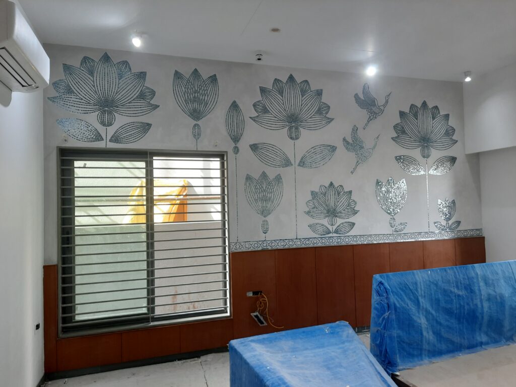 Residential project wall featuring handcrafted Thikri mirror art by Yuvarti Craft Studio, showcasing traditional Rajasthani mirror inlay work in modern interiors