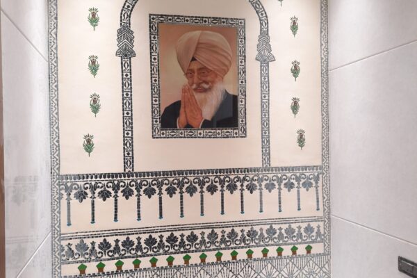 Residential project wall featuring Thikri mirror art combined with hand-painted artwork by Yuvarti Craft Studio, blending traditional craftsmanship with modern interiors