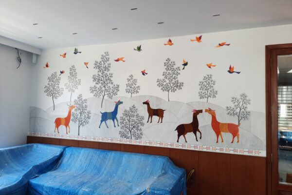 Residential project wall featuring hand-painted Gond Art by Yuvarti Craft Studio, showcasing traditional tribal patterns and nature-inspired storytelling.